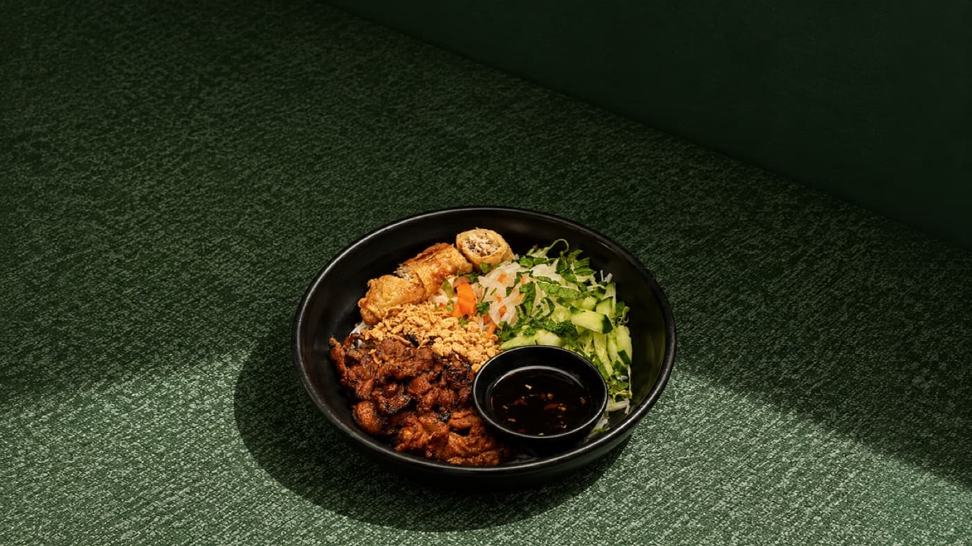 Bun Mam vermicelli bowl with grilled meat and fresh salad