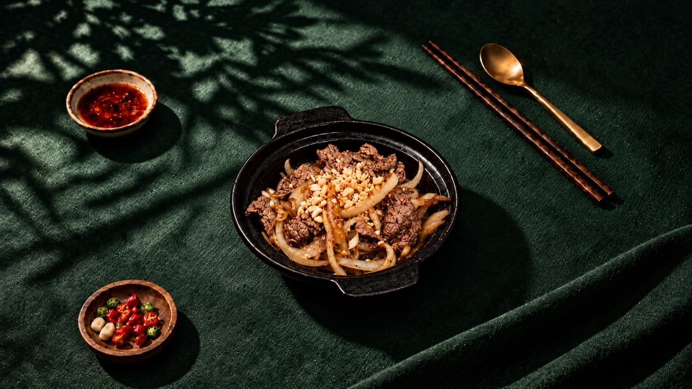 Campfire beef tenderloin with onions and peanuts
