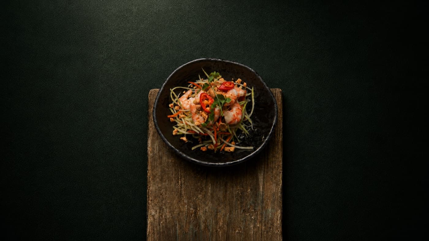 Fresh papaya salad topped with prawns