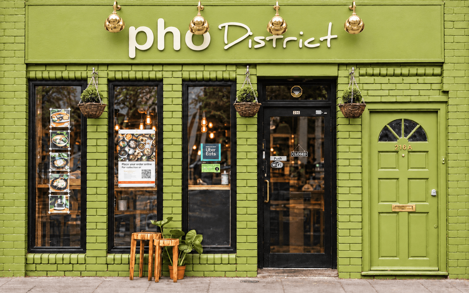 Pho District’s olive green storefront on King Street